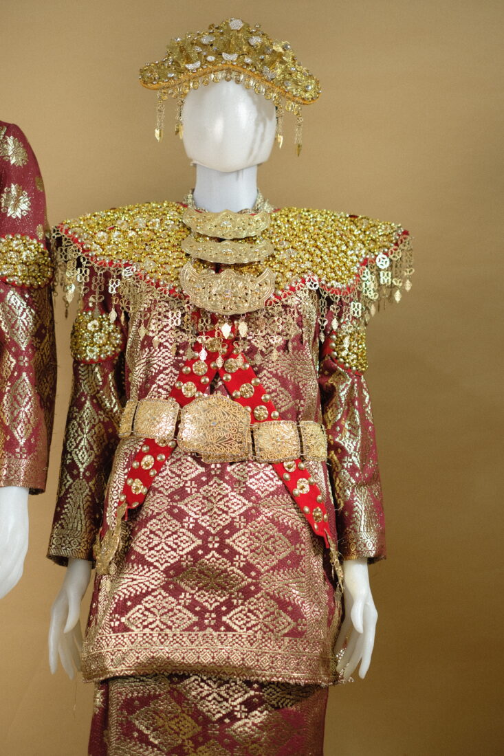 Busana Palembang Songket Maroon
